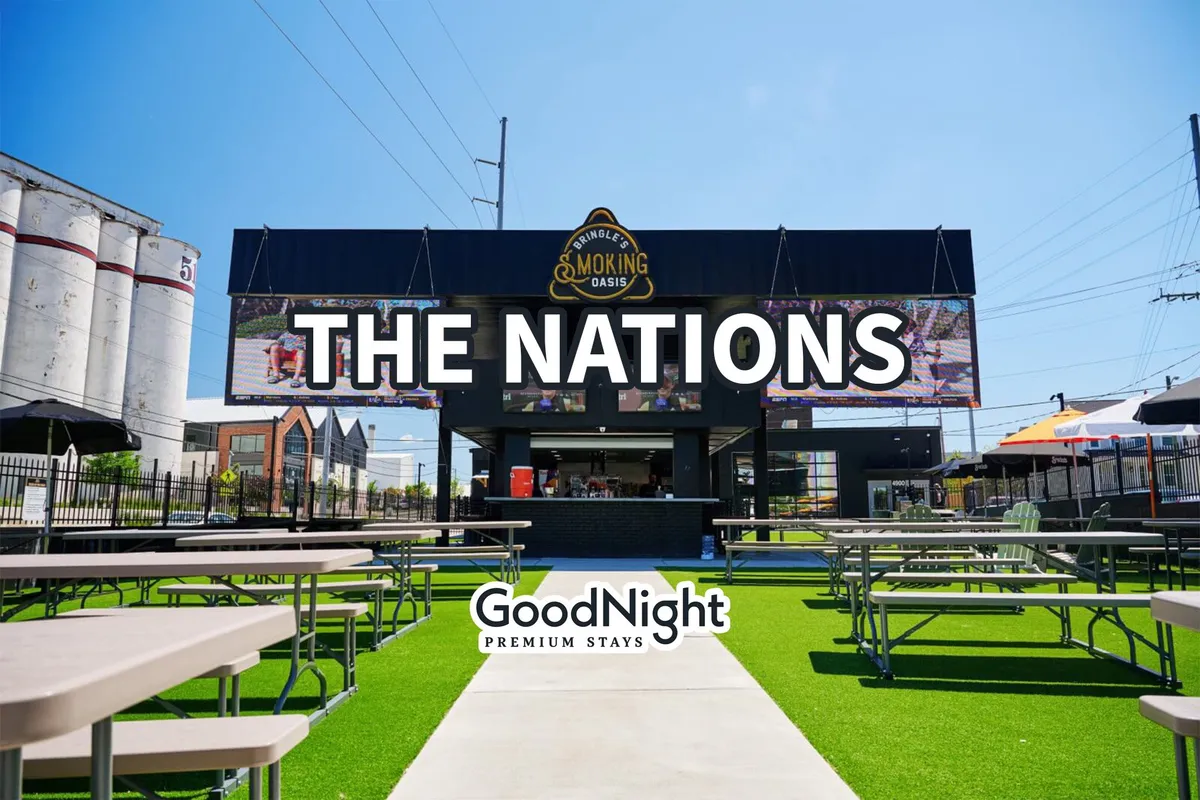 This scene displays The Nations’ prominent sign, bustling outdoor seating area, and active food service setup, encapsulating a lively community atmosphere ideal for group dining and casual encounters.