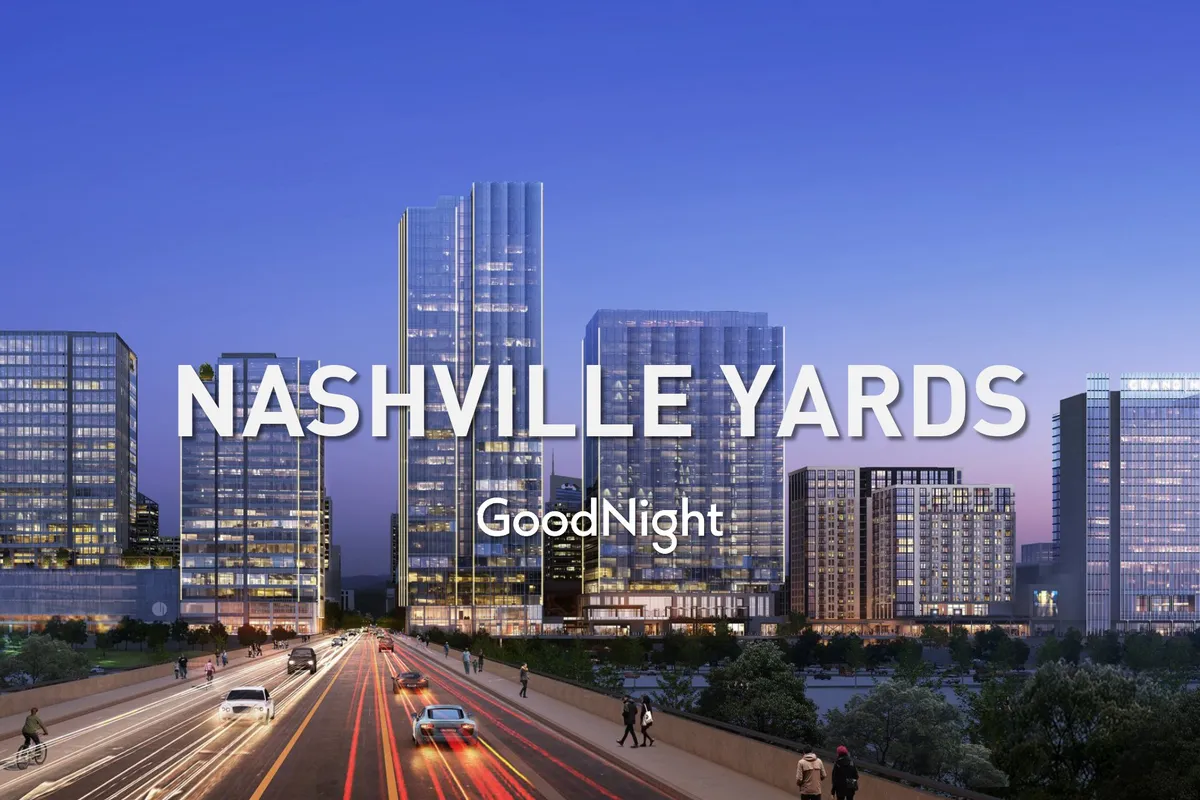 A vibrant cityscape showing illuminated skyscrapers and bustling streets at night. The image captures the energetic downtown atmosphere, highlighting Nashville’s urban vibe and proximity to business and entertainment hubs.